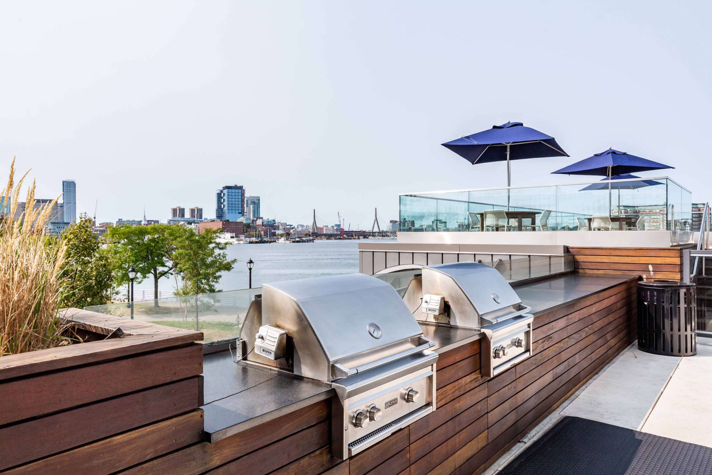 The Eddy East Boston Apartments rooftop terrace with grills